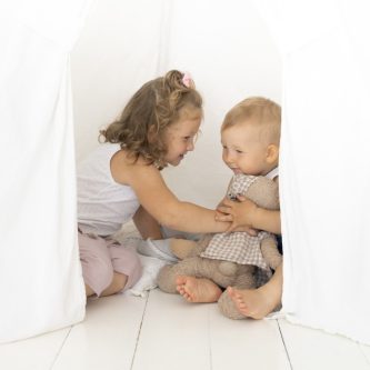 full-shot-kids-playing-tent